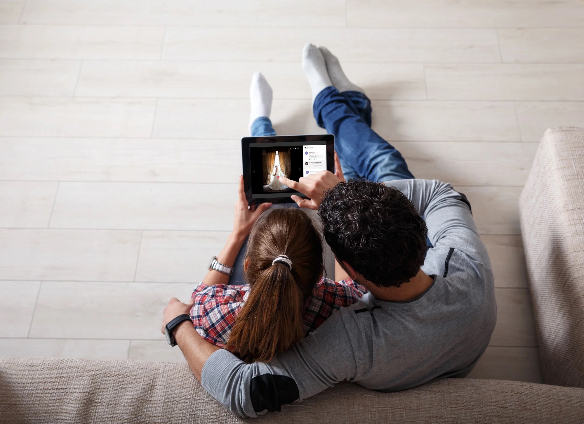 Couple relaxing with a tablet